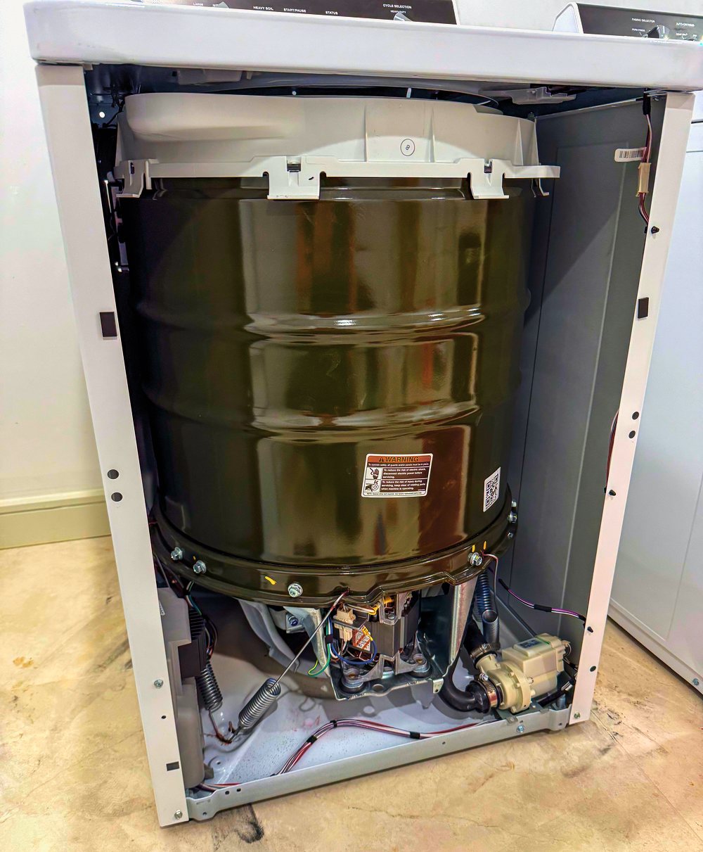 Appliance Rescue Team technician repairing a Speed Queen commercial washer as a factory-authorized Speed Queen service provider