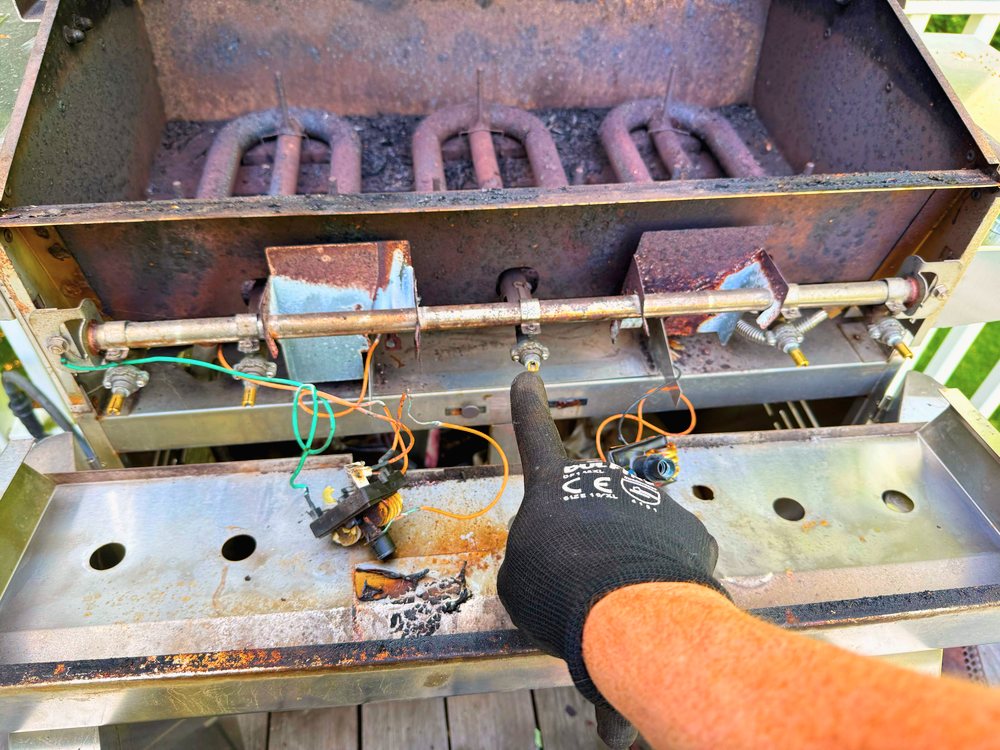 Appliance Rescue Team technician replacing a faulty gas valve on an outdoor grill in Oradell, Bergen County, NJ