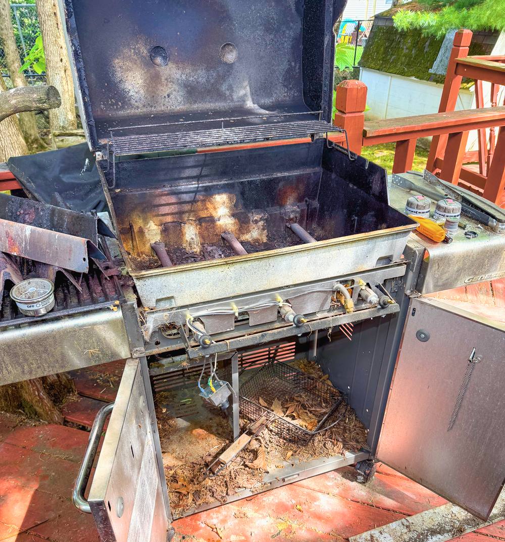Appliance Rescue Team technician repairing an outdoor gas grill in Bergen County, NJ