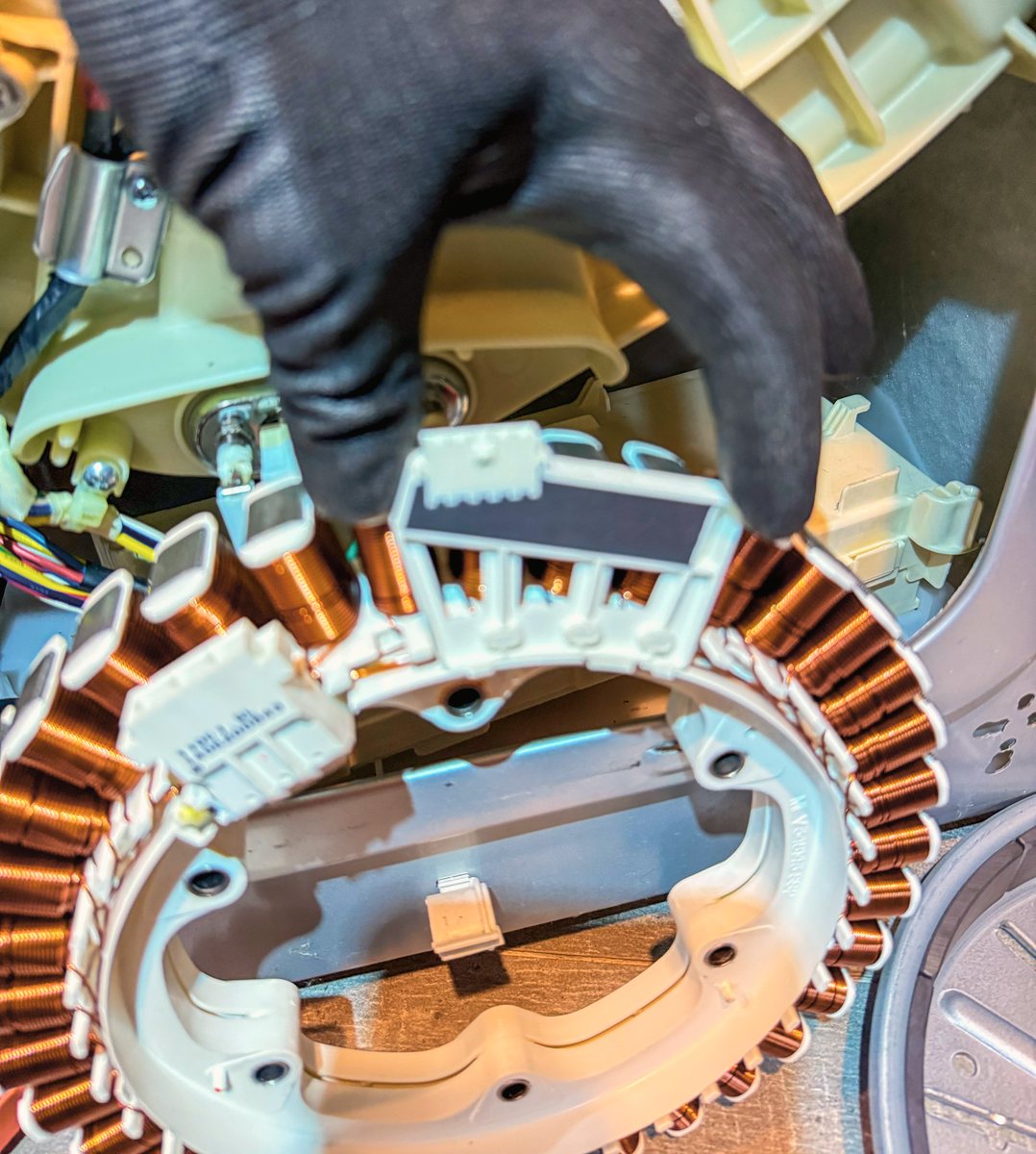 Appliance Rescue Team technician replacing a washing machine stator and drive motor in Bergen County, NJ