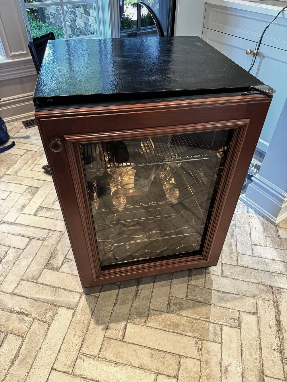 Appliance Rescue Team technician servicing an undercounter wine cooler in Bergen County, NJ