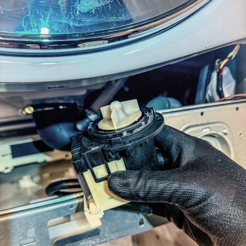 Appliance Rescue Team technician replacing a washer drain pump in Englewood, NJ